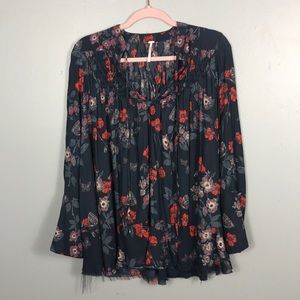 - FREE PEOPLE like new blouse with bottom fray